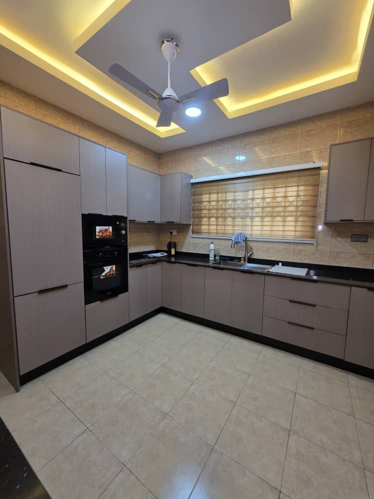 Fitted kitchen with built-in oven and microwave